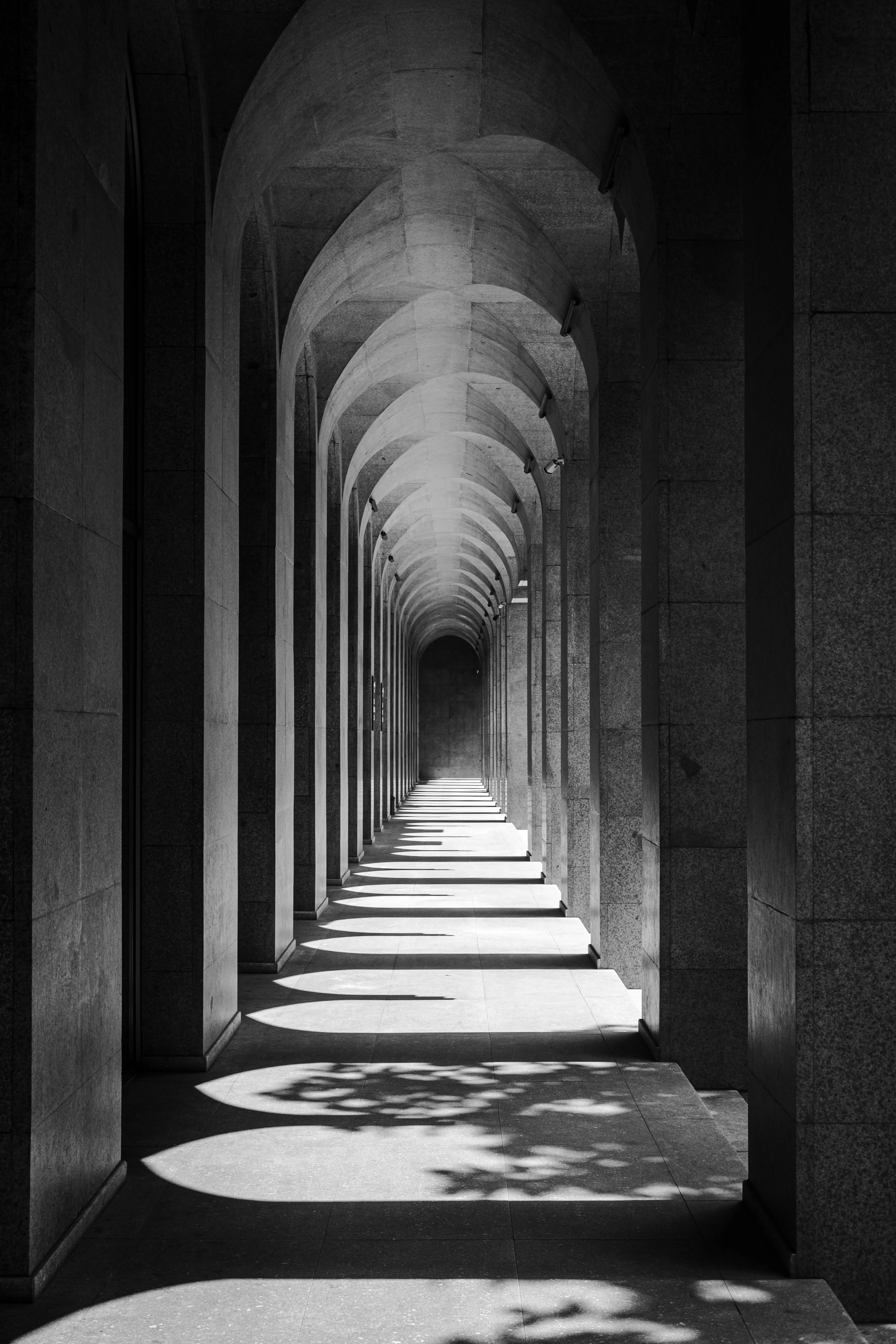 Dark roman style columns with ominous shadows