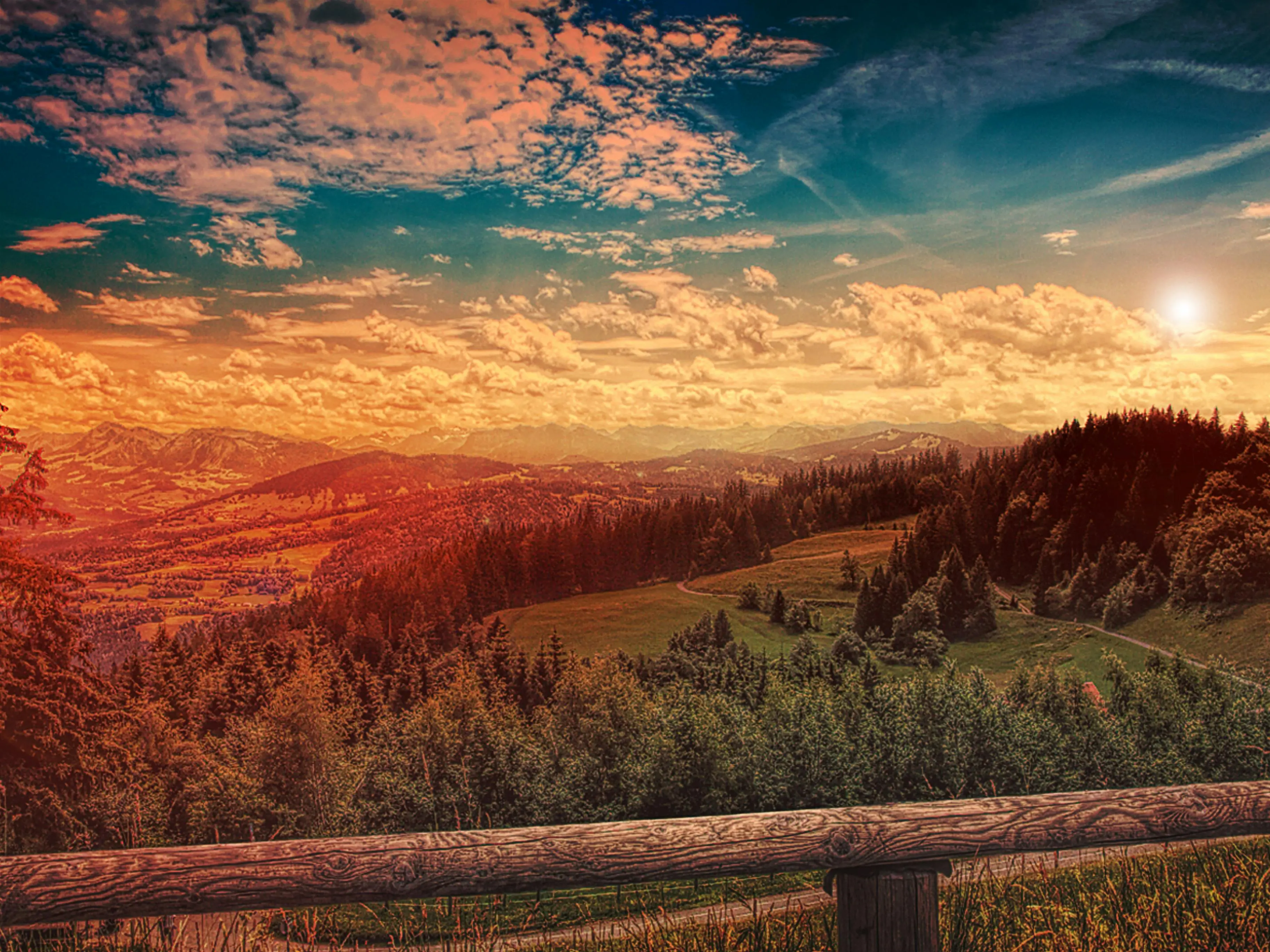 Afternoon mountain range shot with trees and mildly cloudy